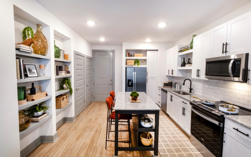 a kitchen with white cabinets