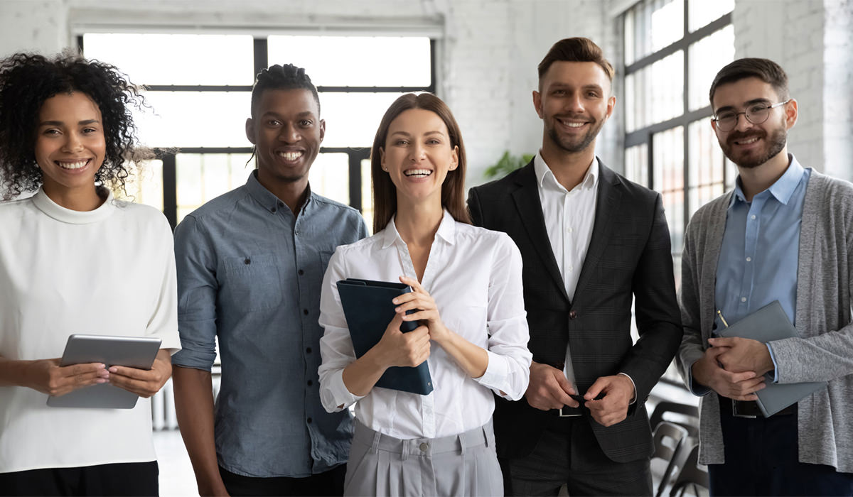 office workers posing for picture